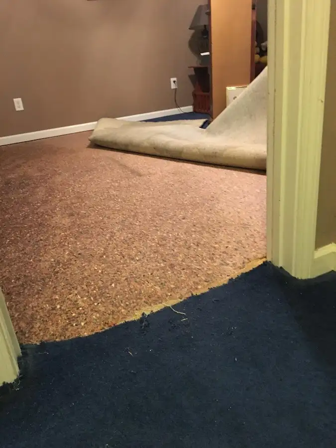 Carpet pad removal revealing water damage during Drying & Dehumidification in Chandler